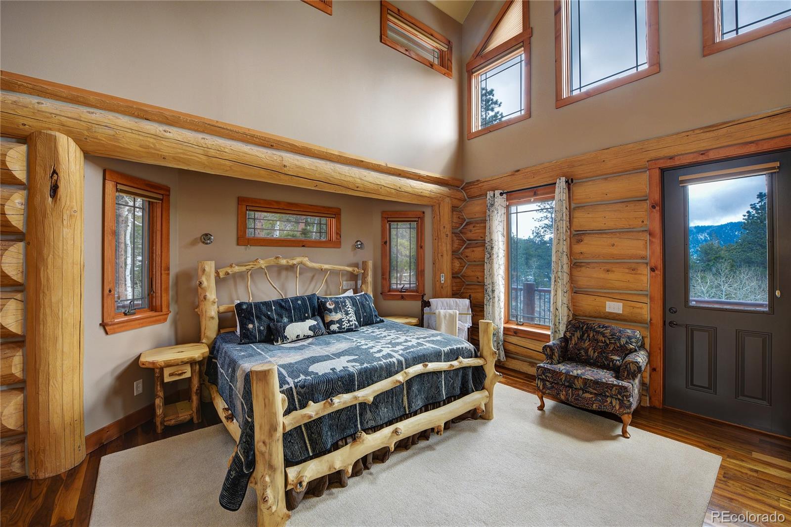 500 Ridge Road Ward, CO 80481 - Photo 12 of 31 a bedroom with furniture and a large window