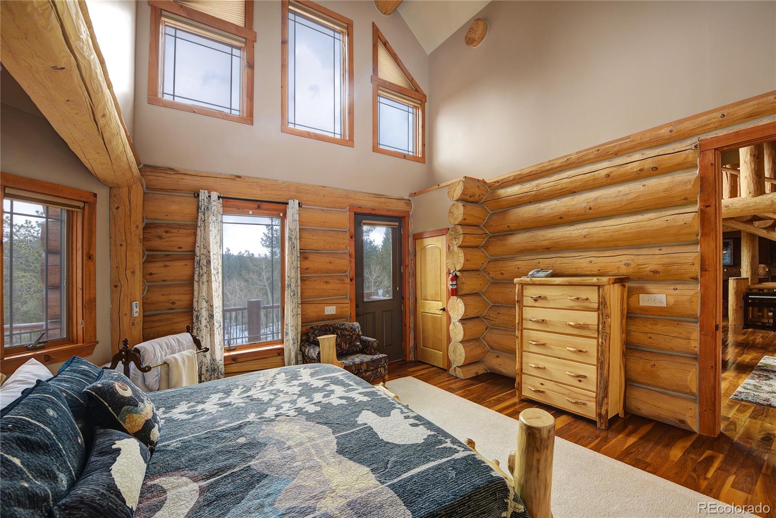 500 Ridge Road Ward, CO 80481 - Photo 13 of 31 a bedroom with a bed and a dresser