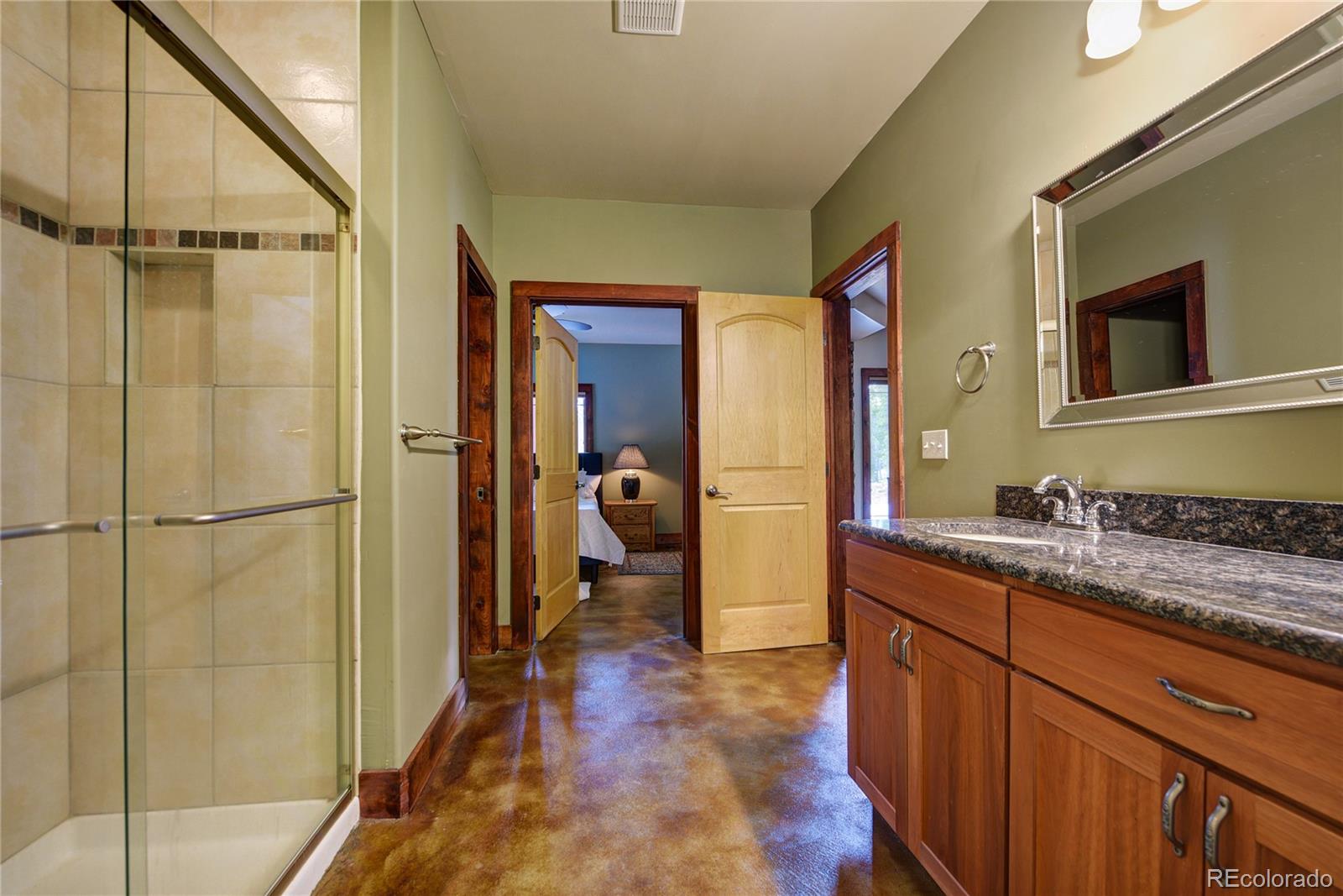 500 Ridge Road Ward, CO 80481 - Photo 20 of 31 a hallway with a sink and a refrigerator