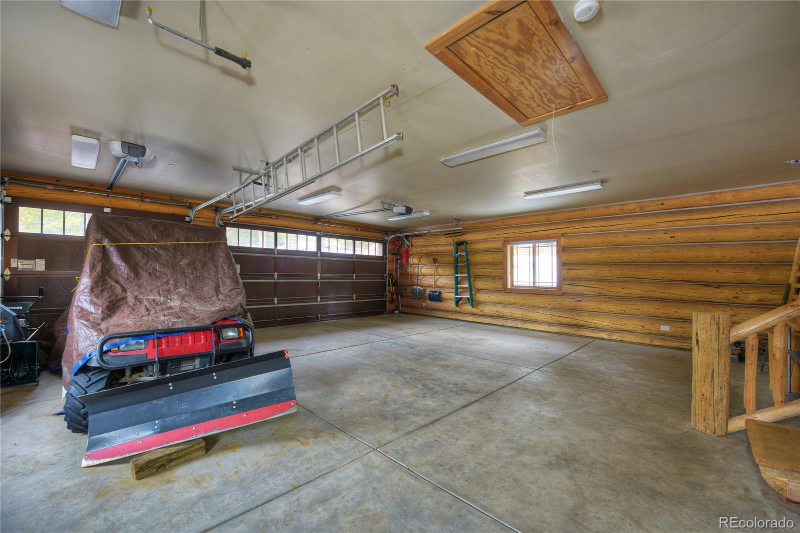 500 Ridge Road Ward, CO 80481 - Photo 25 of 31 a garage with storage and a white walls