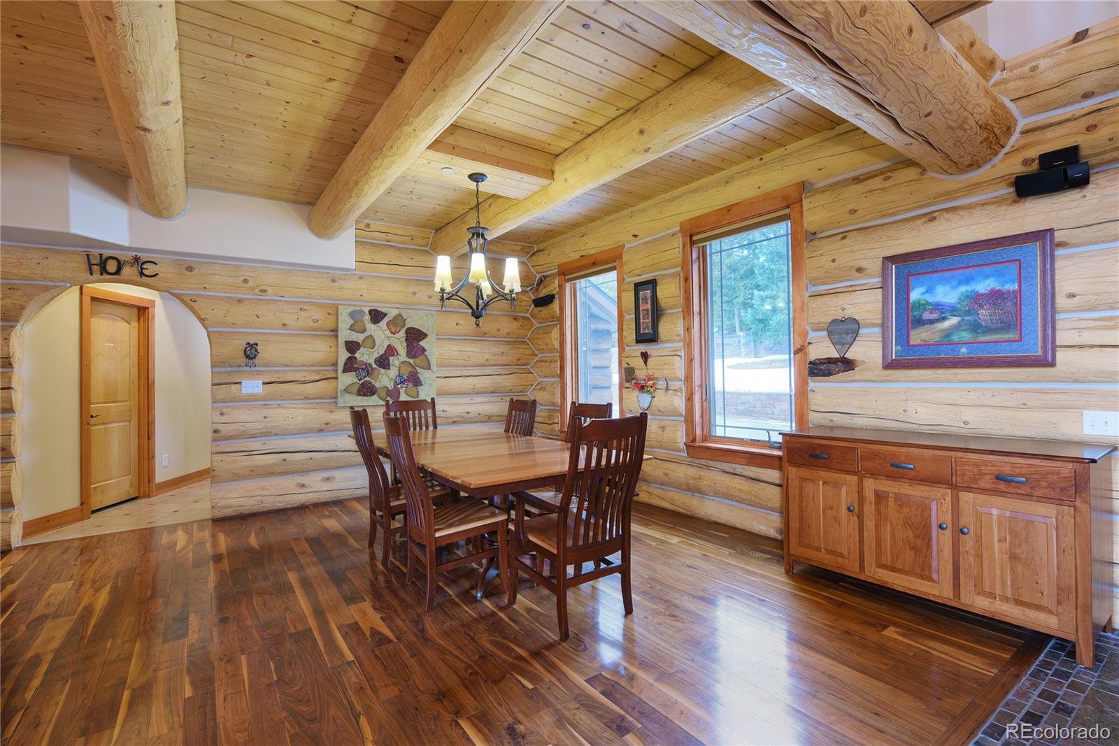 500 Ridge Road Ward, CO 80481 - Photo 3 of 31 a view of a dining room with furniture and wooden floor