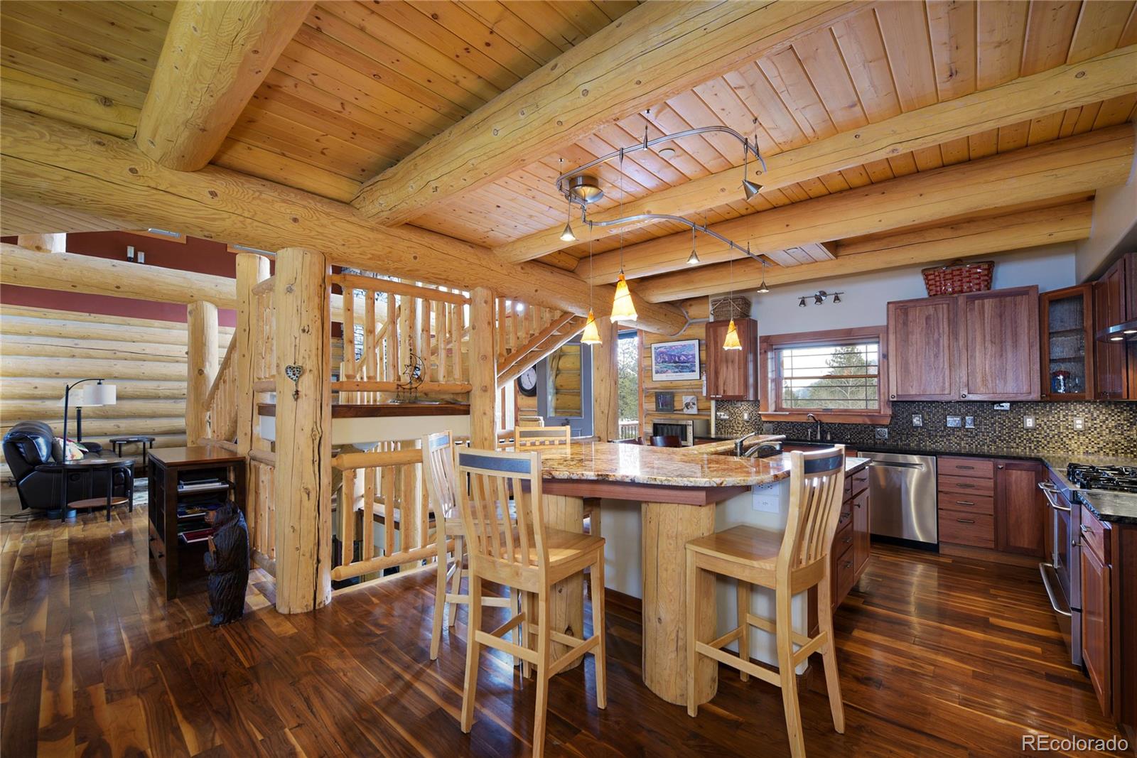 500 Ridge Road Ward, CO 80481 - Photo 6 of 31 a kitchen with lots of wooden furniture appliances and cabinets