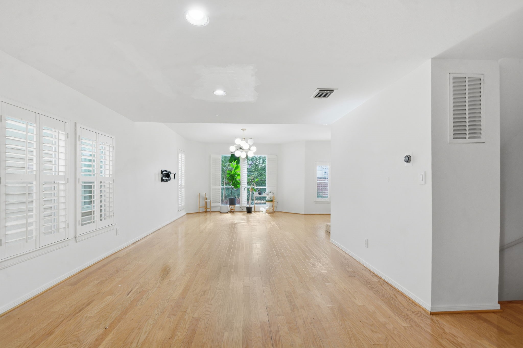 1714 West Webster Street Houston, TX 77019 - Photo 18 of 39 wooden floor in an empty room with a window