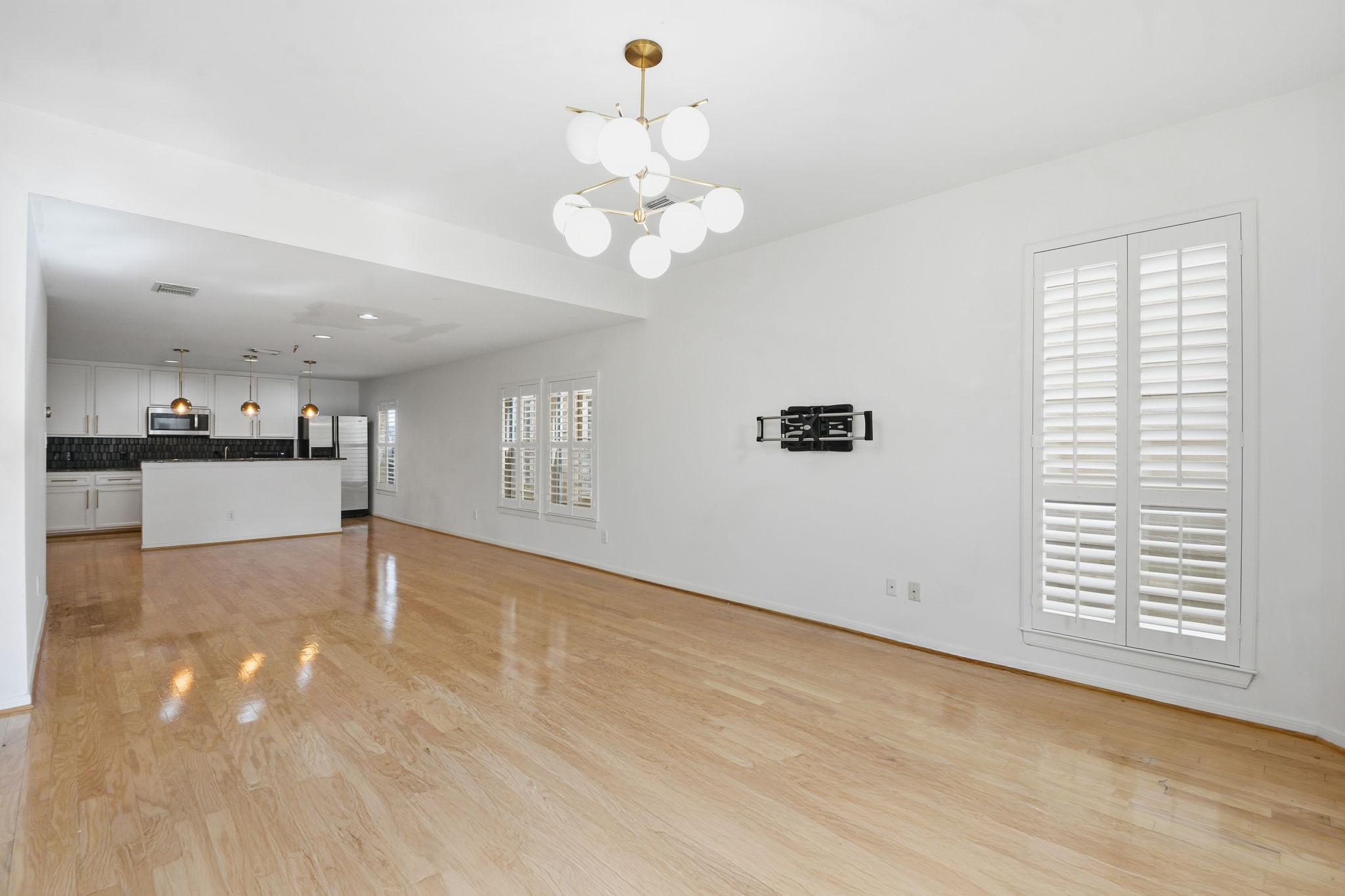 1714 West Webster Street Houston, TX 77019 - Photo 19 of 39 a view of a kitchen with a dishwasher cabinets and wooden floor