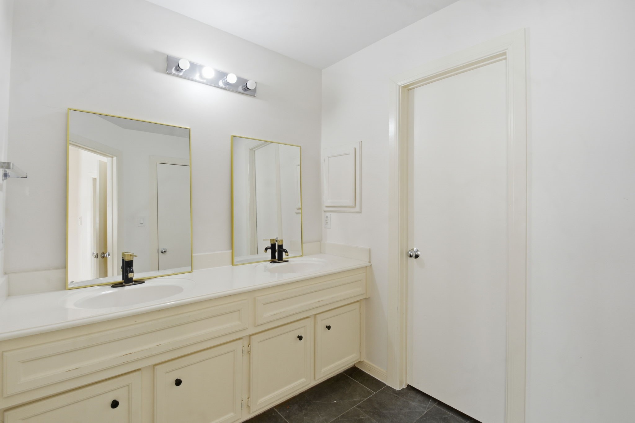 1714 West Webster Street Houston, TX 77019 - Photo 29 of 39 a bathroom with a sink and a mirror