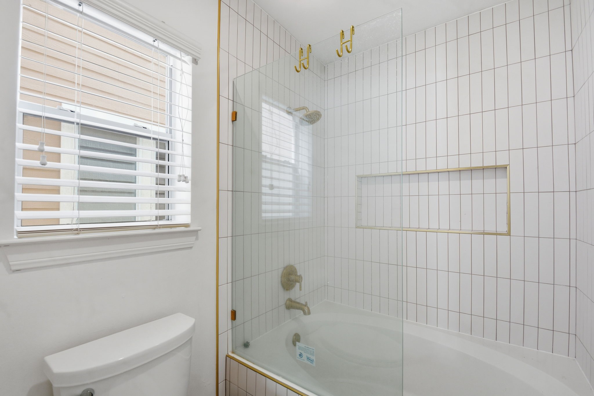 1714 West Webster Street Houston, TX 77019 - Photo 32 of 39 a bathroom with a toilet and shower
