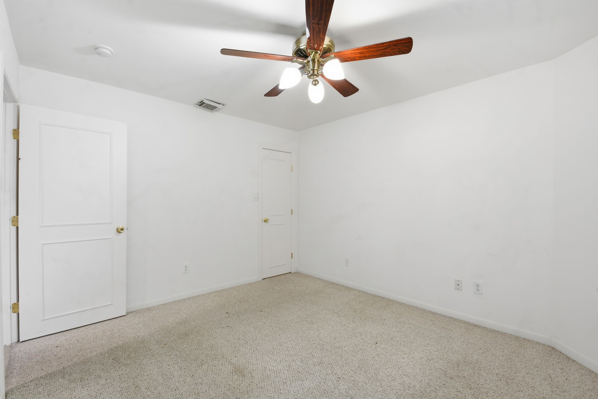1714 West Webster Street Houston, TX 77019 - Photo 9 of 39 an empty room with a fan and a fan