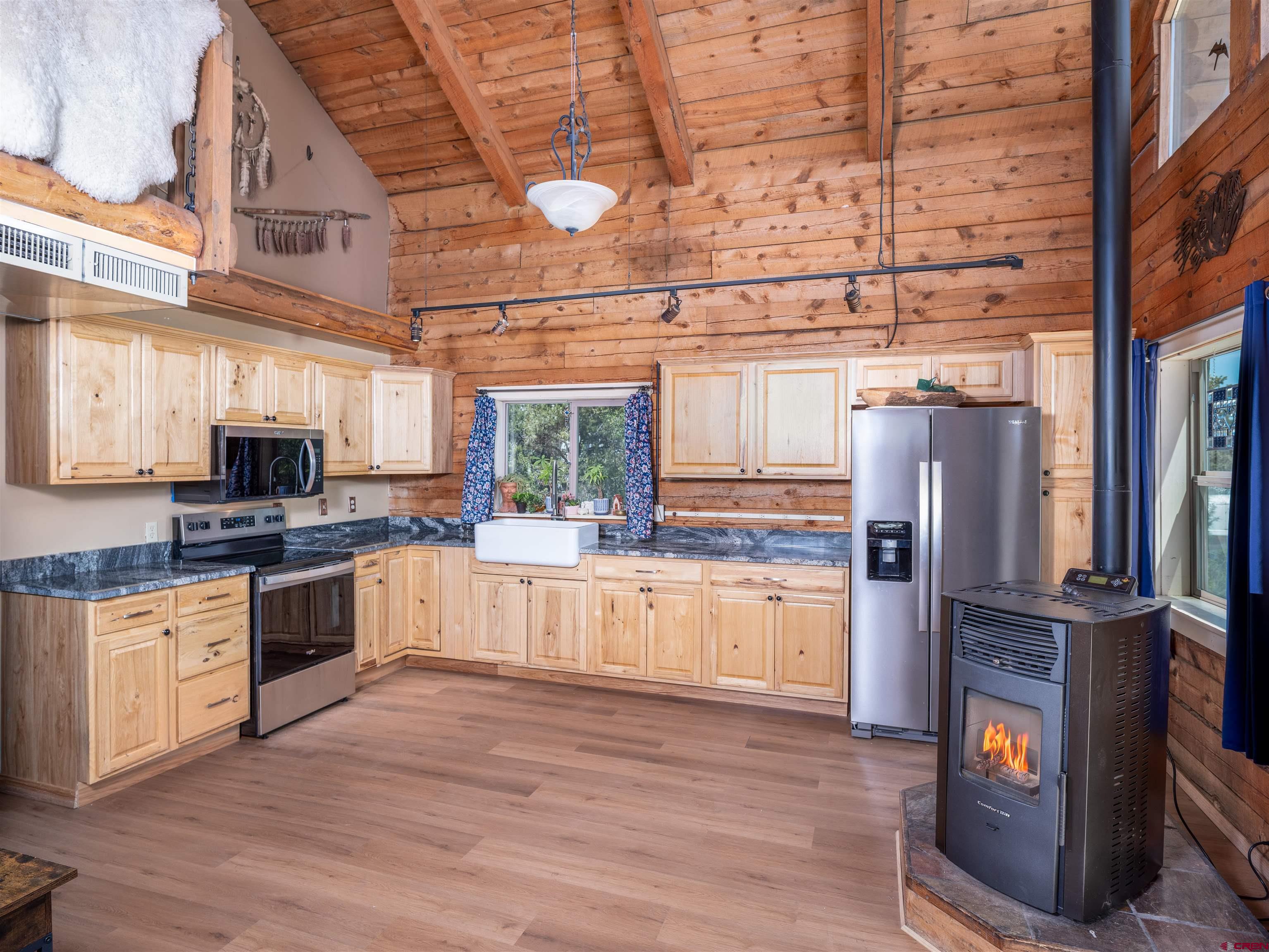 36859 Rd P.2 Mancos, CO 81328 - Photo 5 of 28 a large kitchen with stainless steel appliances granite countertop a stove and a refrigerator