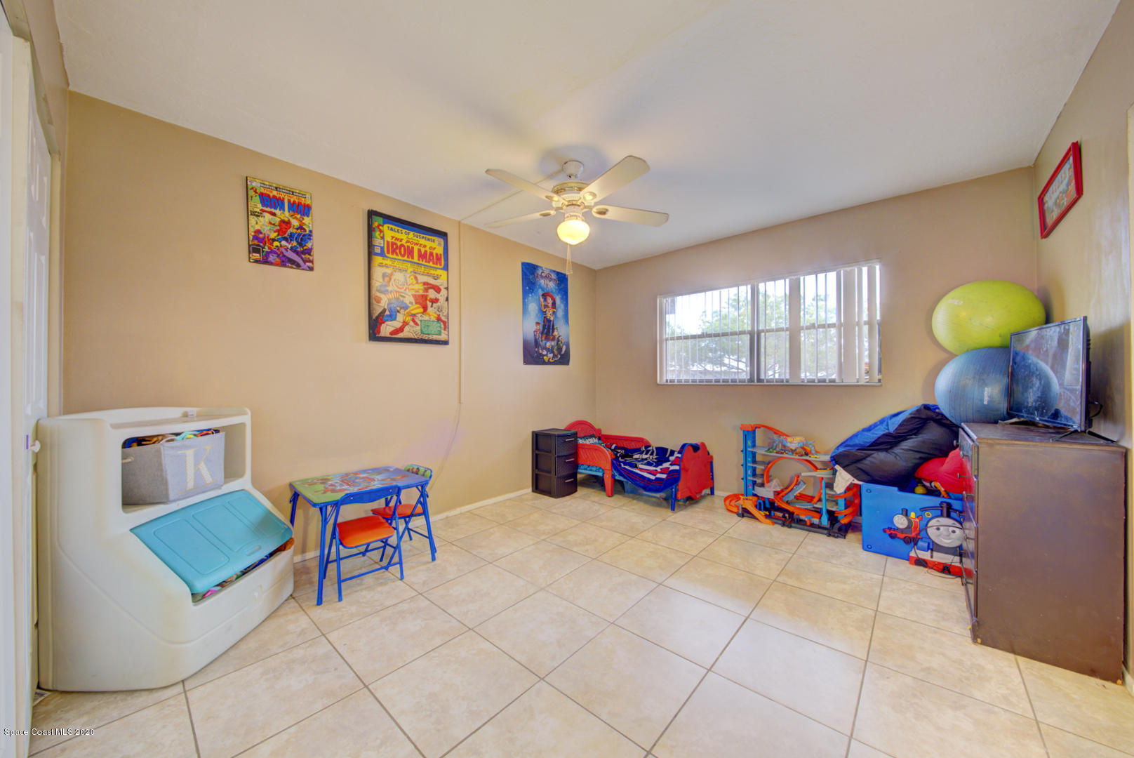 325 Tangle Run Boulevard, Unit 1125 Melbourne, FL 32940 - Photo 15 of 22 a living room with baby toys and a couch