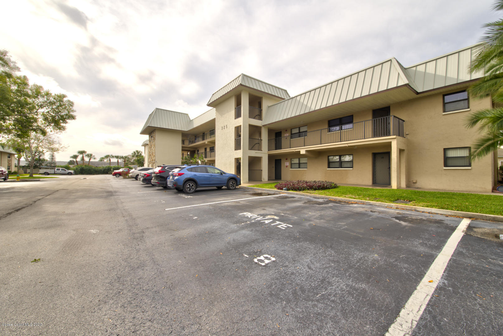325 Tangle Run Boulevard, Unit 1125 Melbourne, FL 32940 - Photo 3 of 22 a car parked in front of a building