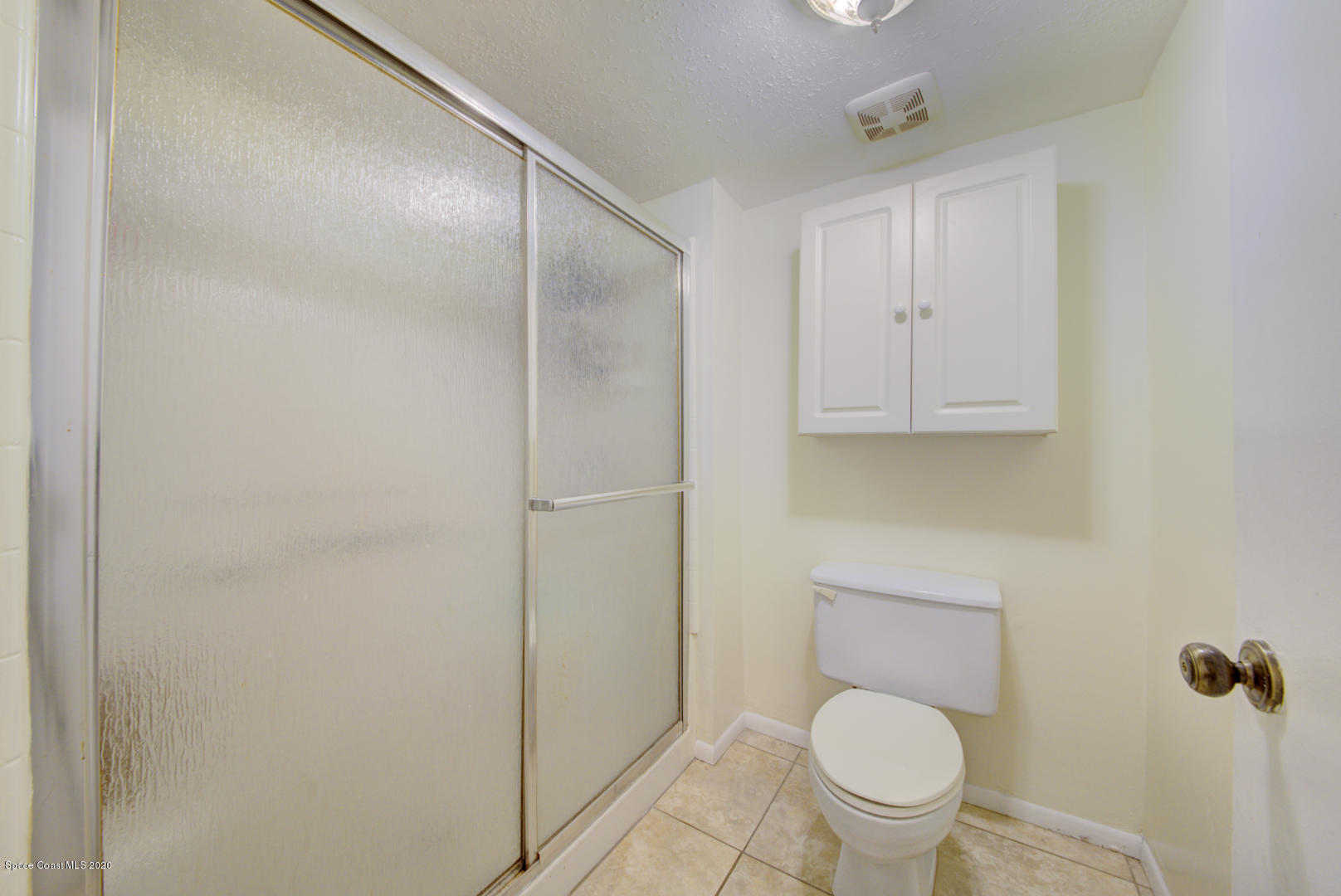 325 Tangle Run Boulevard, Unit 1125 Melbourne, FL 32940 - Photo 22 of 22 a bathroom with a toilet and a shower