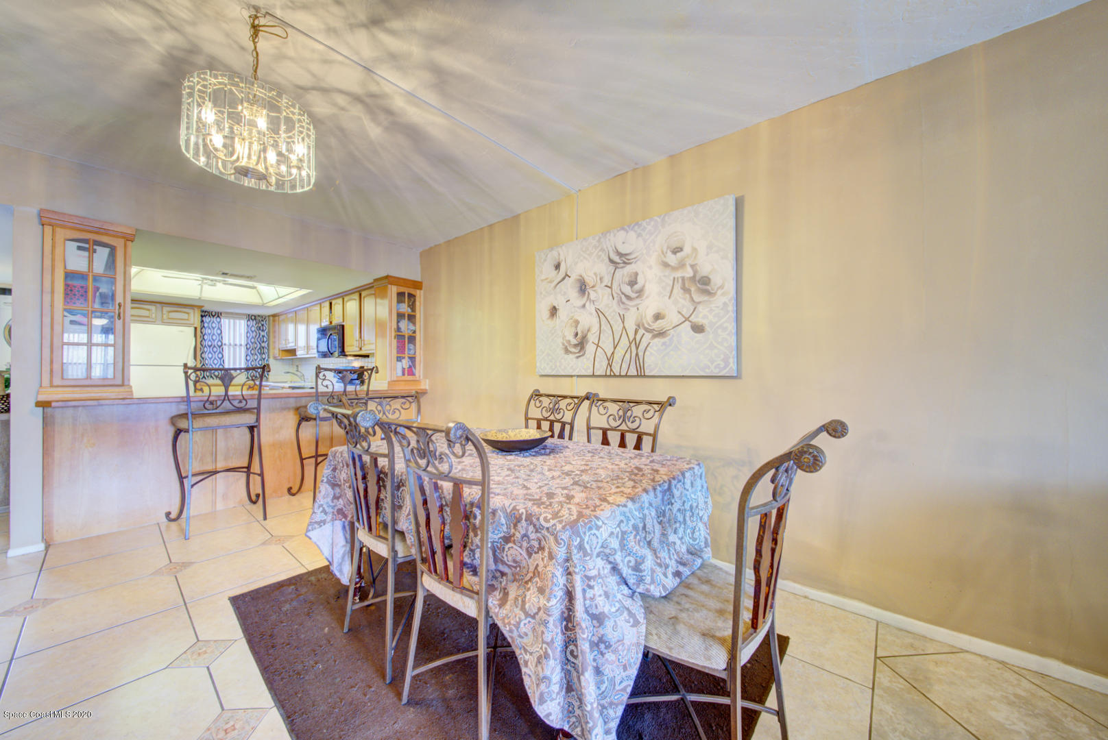 325 Tangle Run Boulevard, Unit 1125 Melbourne, FL 32940 - Photo 9 of 22 a view of a dining room with furniture