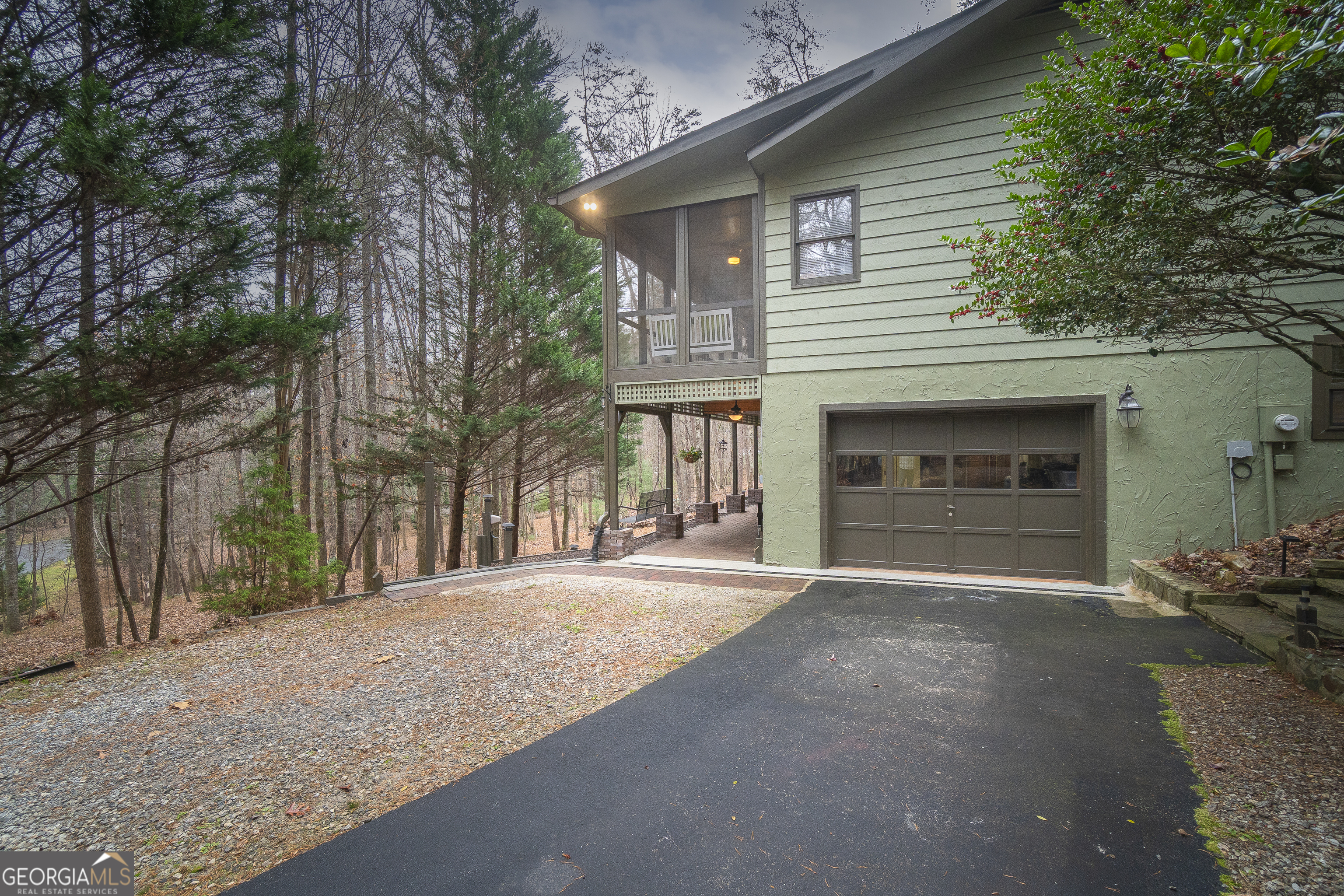 168 Cherokee Trail Sautee Nacoochee, GA 30571 - Photo 3 of 80 a front view of a house with a yard and garage