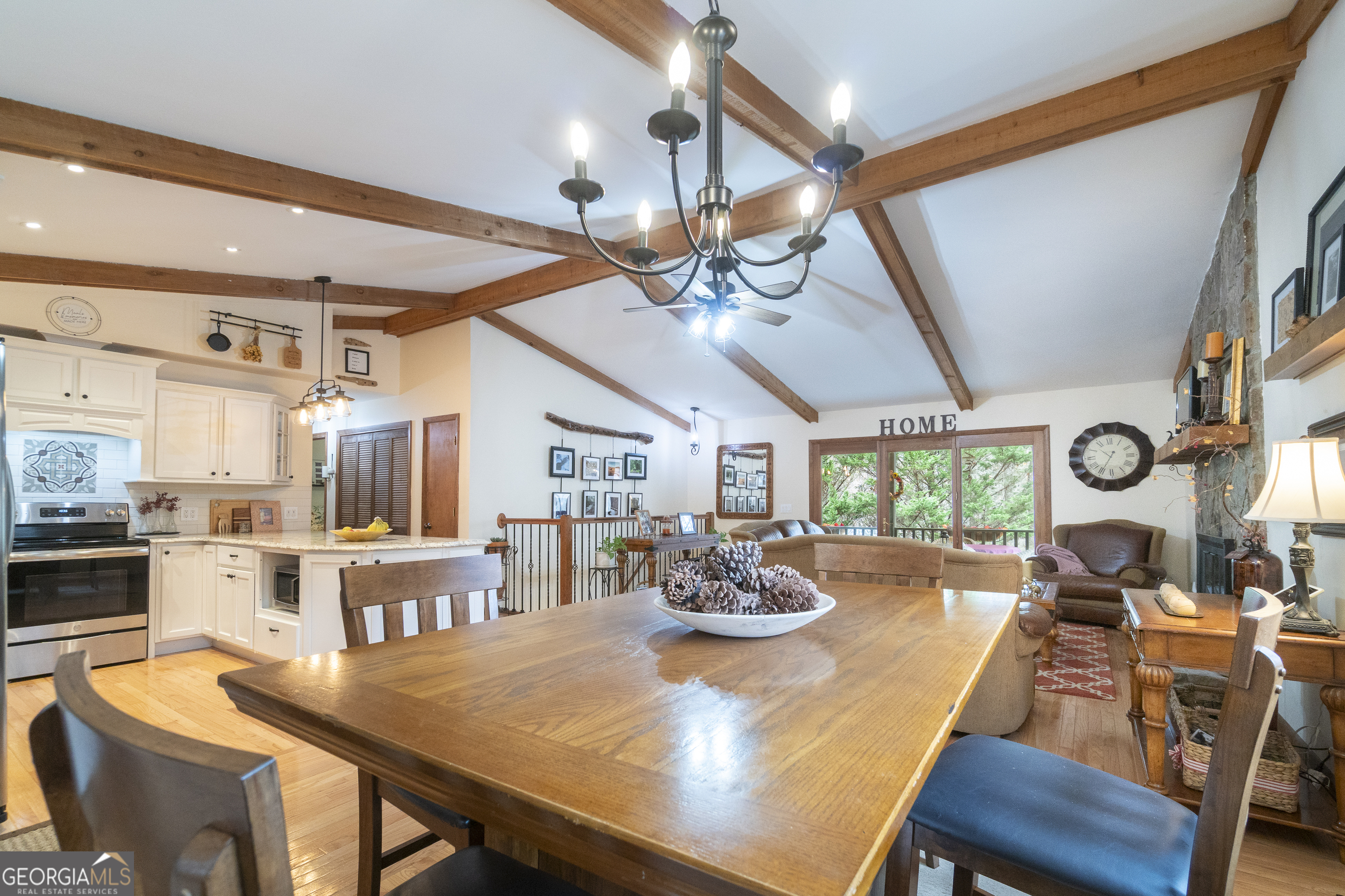 168 Cherokee Trail Sautee Nacoochee, GA 30571 - Photo 38 of 80 a view of a dining room with furniture a chandelier and wooden floor