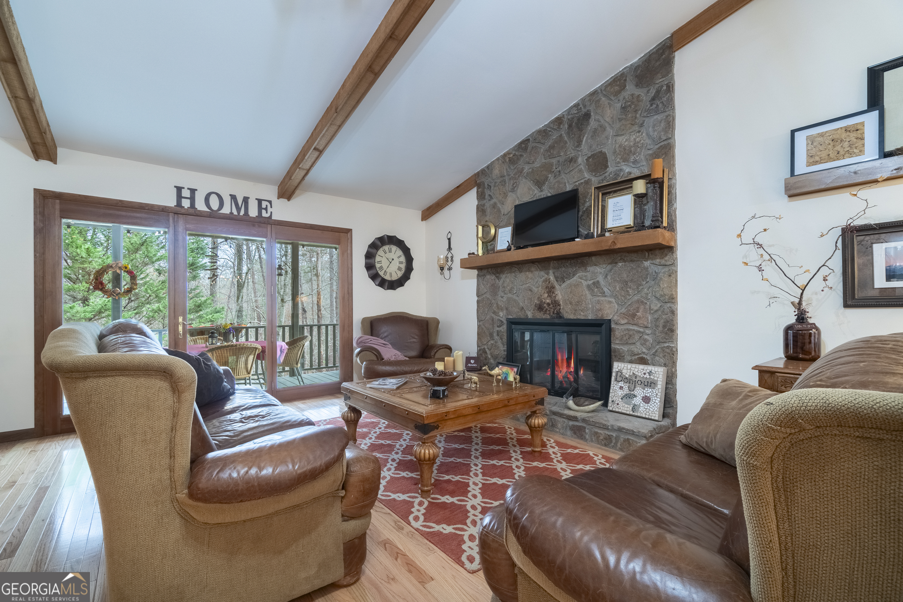 168 Cherokee Trail Sautee Nacoochee, GA 30571 - Photo 41 of 80 a living room with furniture a large window and a fireplace