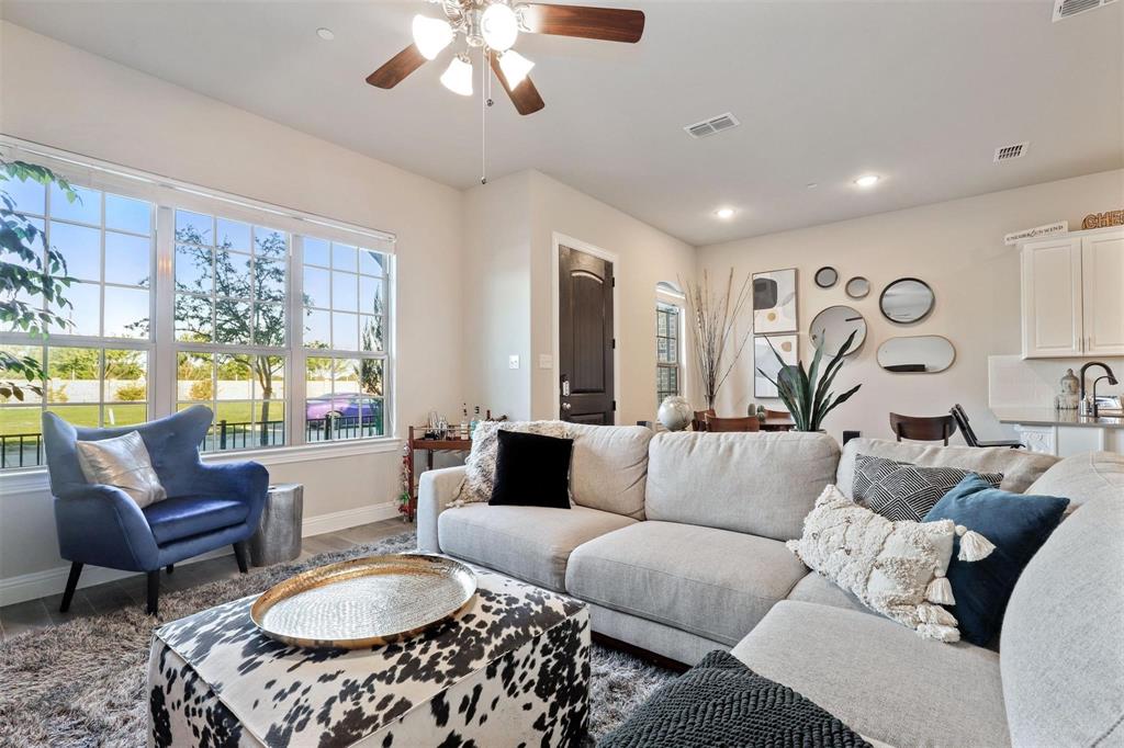 6246 Rilla Street Frisco, TX 75035 - Photo 6 of 26 a living room with furniture and a large window