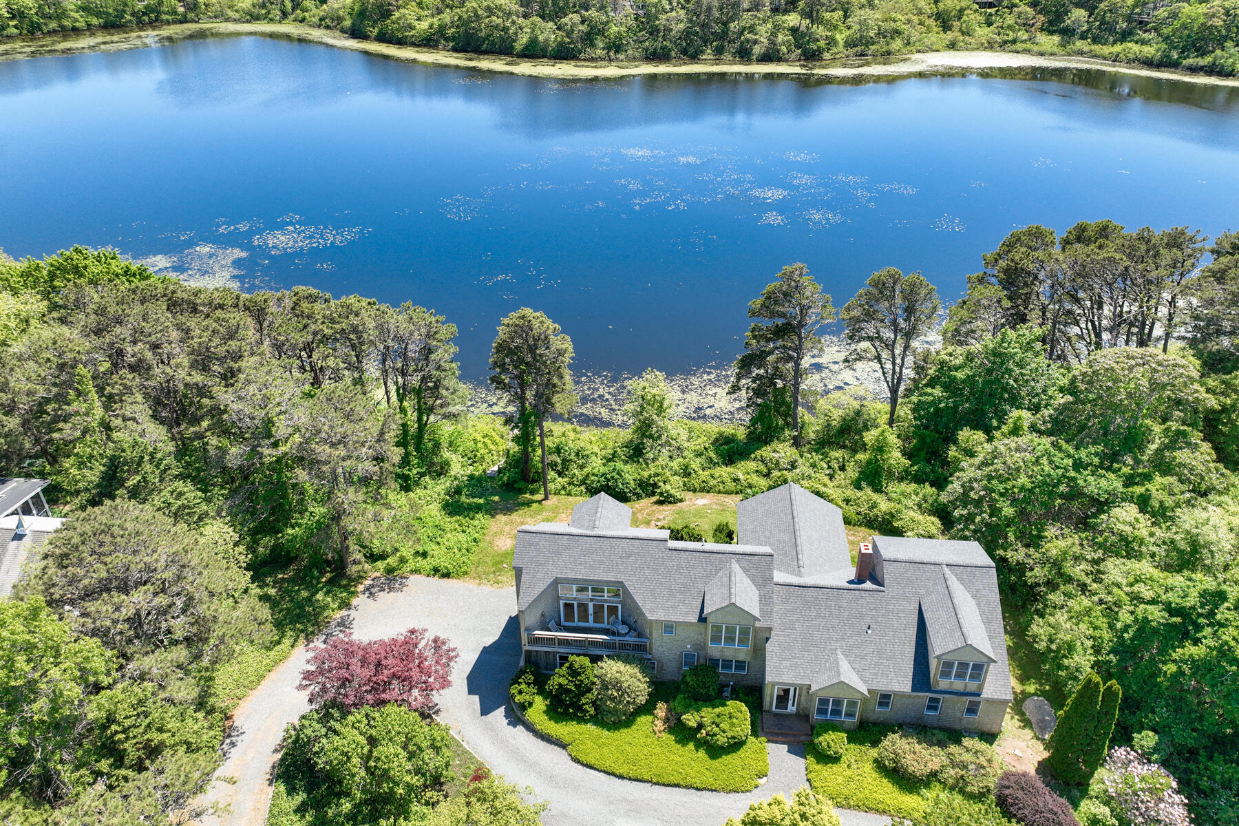 47 Governor Prence Road Brewster, MA 02631 - Photo 4 of 74 an aerial view of a house with garden space and lake view