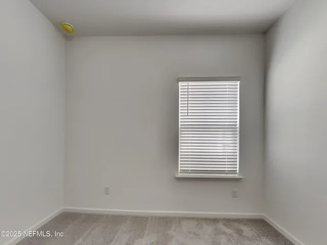 a bathroom with a sink toilet and mirror