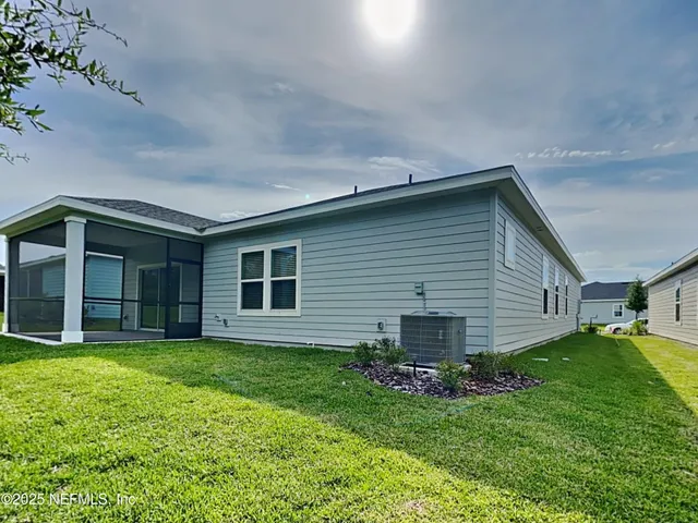 a view of a house with porch and a garden