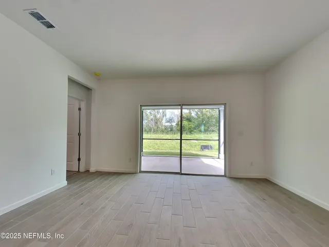 a kitchen with stainless steel appliances a stove microwave and a refrigerator