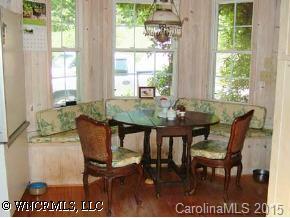 390 Winterset Trail Tryon, NC 28782 - Photo 4 of 8 a view of a dining room with furniture and a window
