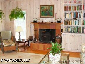390 Winterset Trail Tryon, NC 28782 - Photo 5 of 8 a living room with furniture and a potted plant