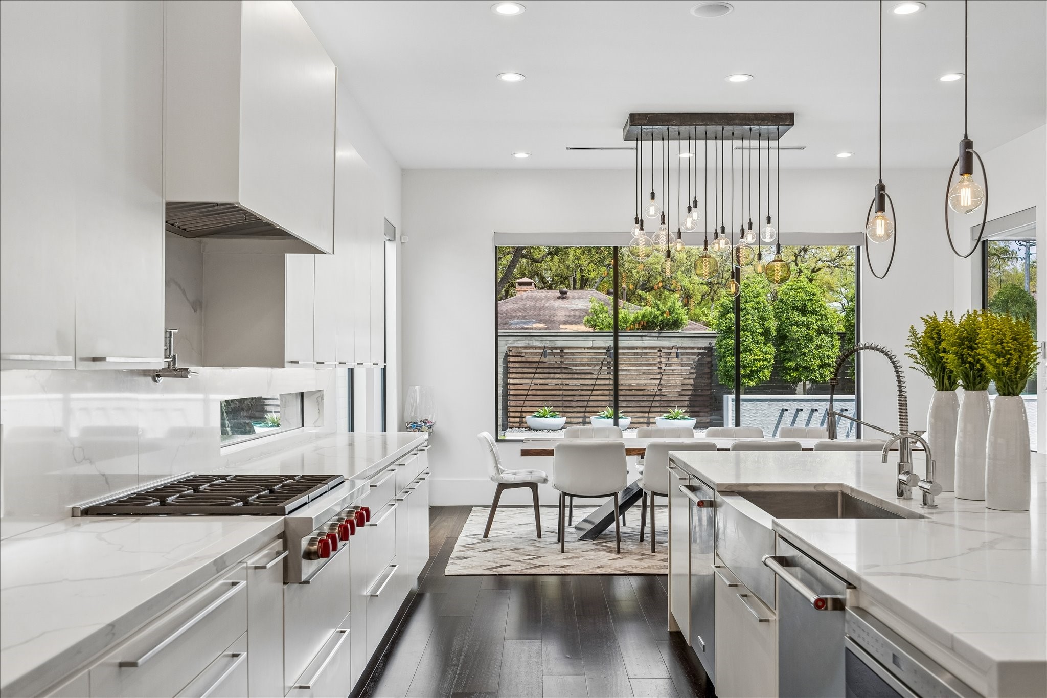 3814 Drake Street Houston, TX 77005 - Photo 18 of 50 The fleet of upscale appliances includes a vented Wolf cooktop with a pot filler, two Wolf wall ovens, two KitchenAid dishwashers, a Wolf microwave drawer, and a Sub-Zero refrigerator-freezer.