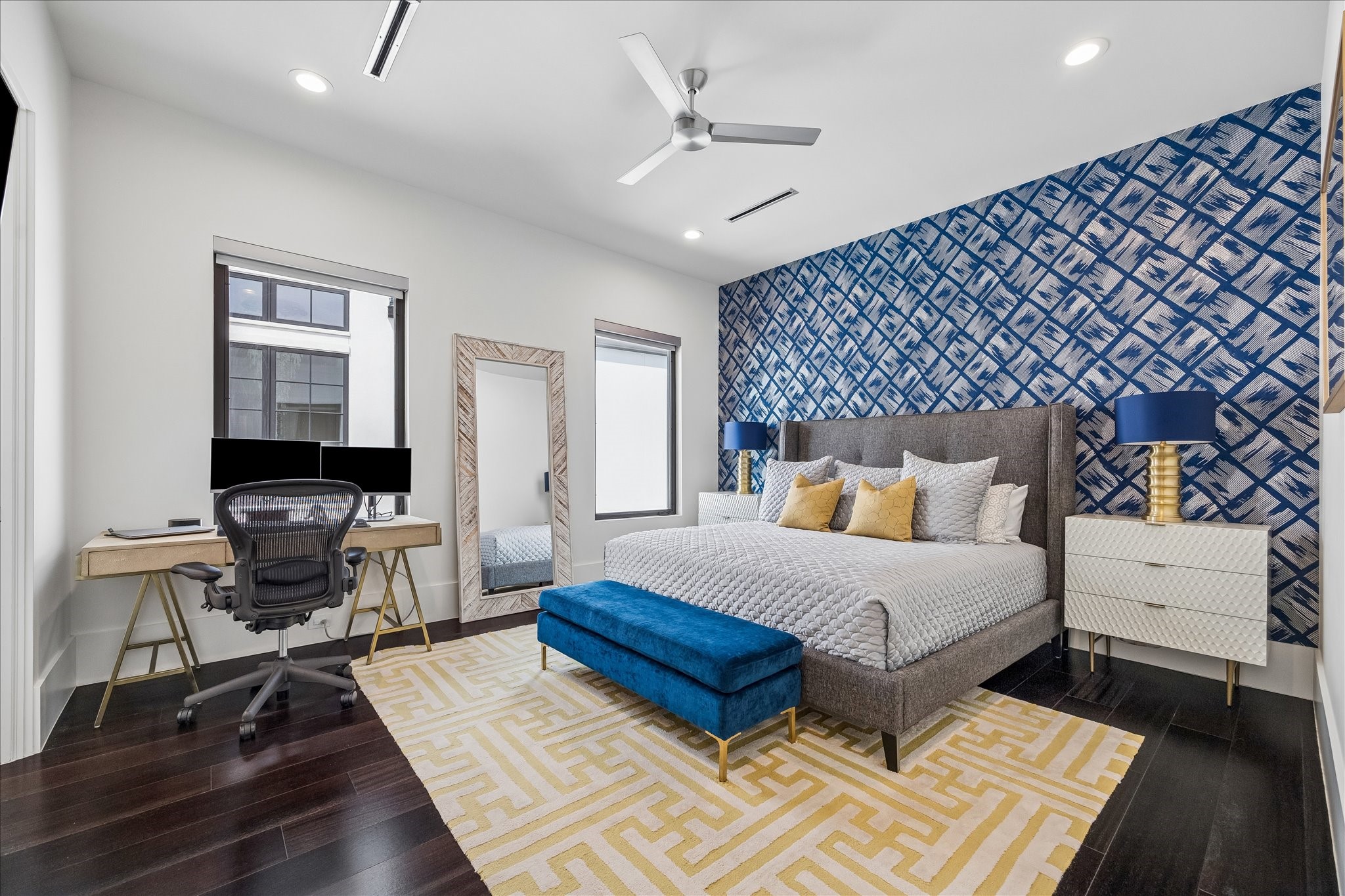 3814 Drake Street Houston, TX 77005 - Photo 35 of 50 In this secondary suite, you’ll find designer wallpaper, a metal ceiling fan, oversized windows, a custom closet and an en suite bathroom.