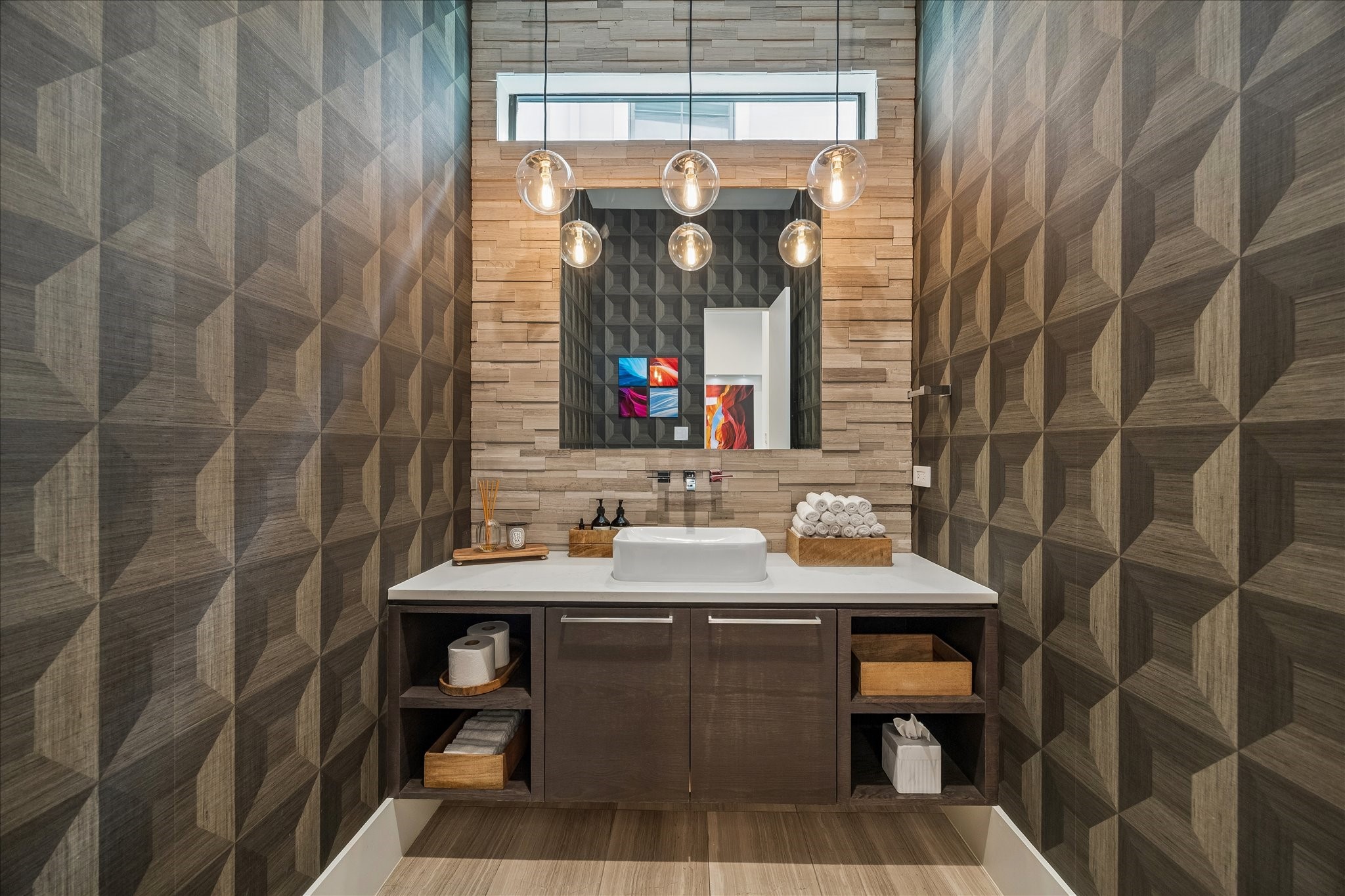 3814 Drake Street Houston, TX 77005 - Photo 9 of 50 In the chic powder room, discover designer wallcoverings, a floating quartz vanity, a floor-to-ceiling stone backsplash, a transom window, pendant lighting and a Toto automatic bidet.