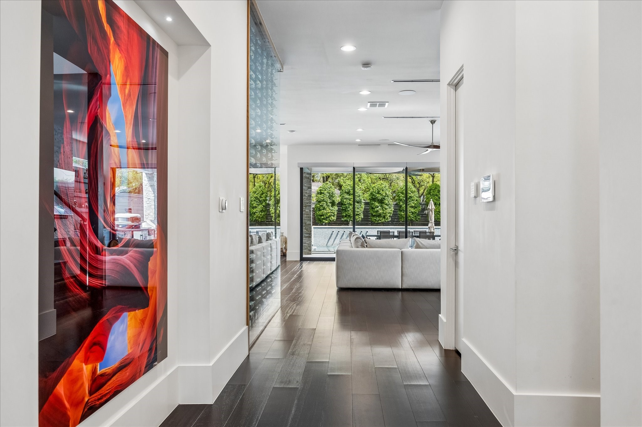 3814 Drake Street Houston, TX 77005 - Photo 10 of 50 The entry gallery includes a large art niche with recessed lighting. Engineered African mahogany hardwood floors are trimmed with 10-inch tall baseboards.