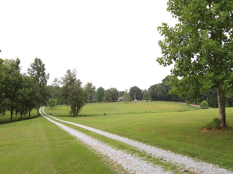 407 County Line Road Timberlake, NC 27583 - Photo 4 of 21 Enjoy the winding road home as you cross the bridge over your very on stream. The eastern boundary of the property is also bordered by a stream. The two intersect near County Line Rd. Driveway