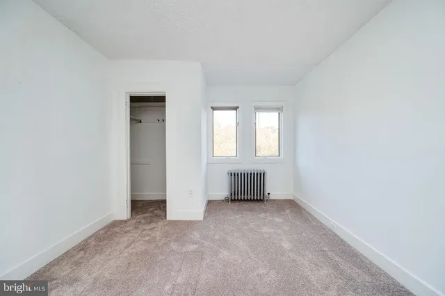 an empty room with windows