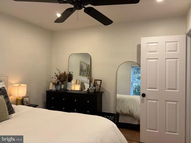 a bedroom with a bed and a dresser