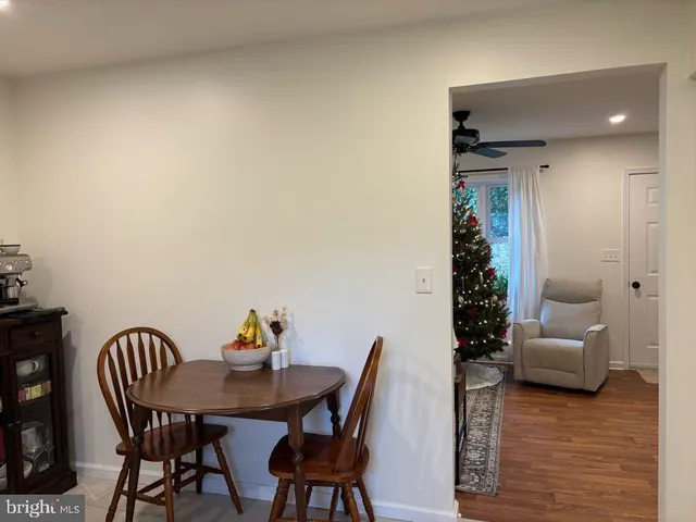 a view of a livingroom with furniture and wooden floor