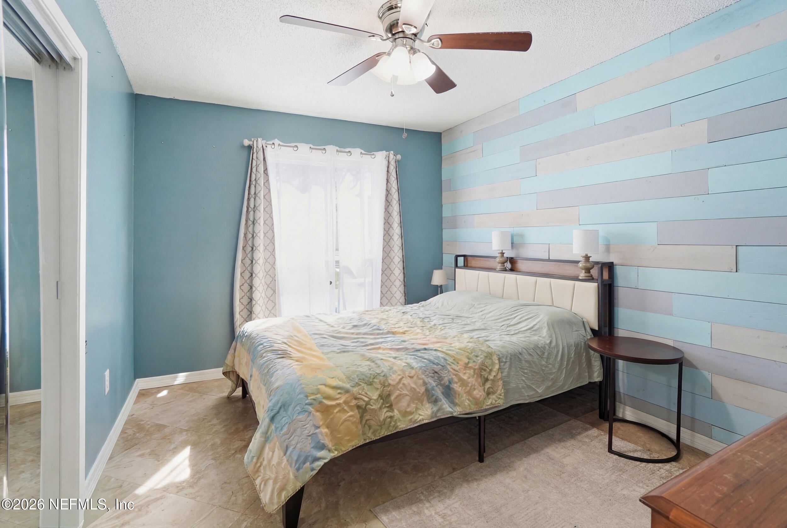 11108 Fairbanks Grant Road West Jacksonville, FL 32223 - Photo 24 of 34 a bedroom with a bed and a chandelier