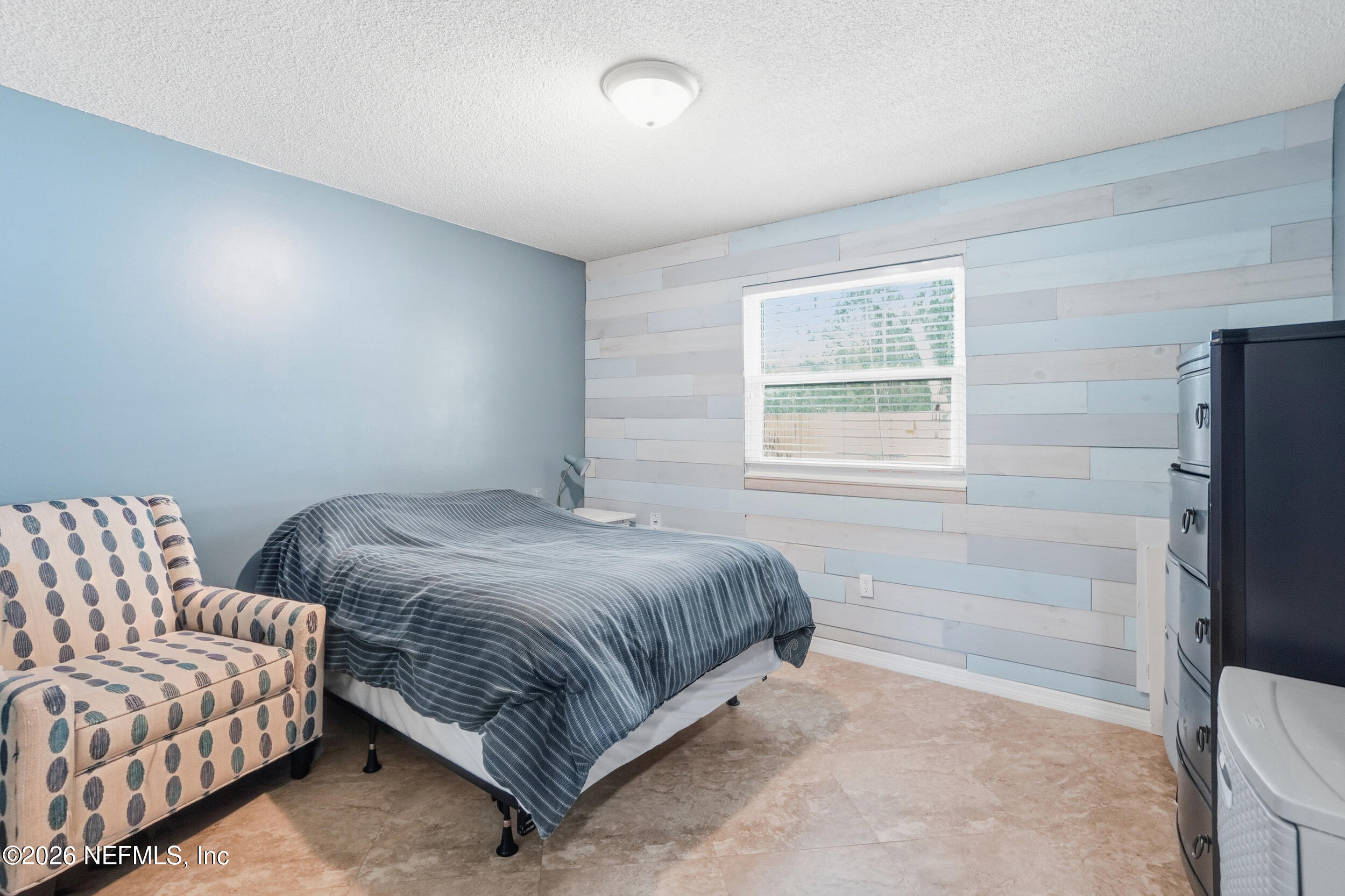 11108 Fairbanks Grant Road West Jacksonville, FL 32223 - Photo 25 of 34 a bedroom with a bed and a window
