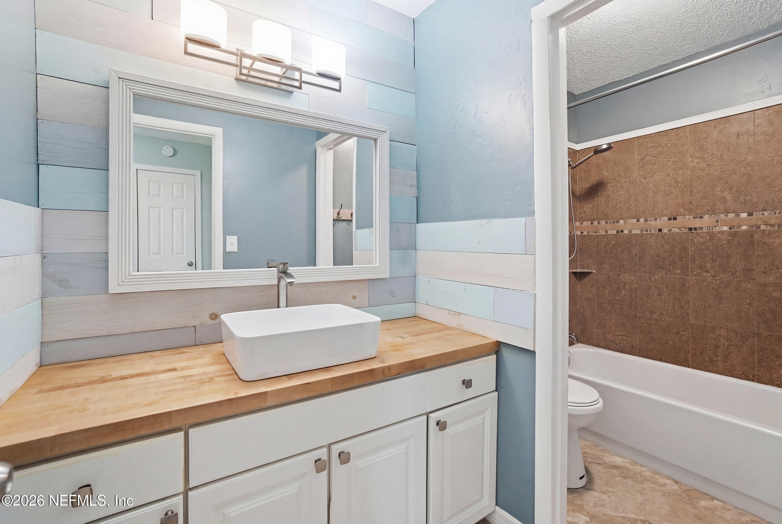 11108 Fairbanks Grant Road West Jacksonville, FL 32223 - Photo 26 of 34 a bathroom with a sink and a mirror