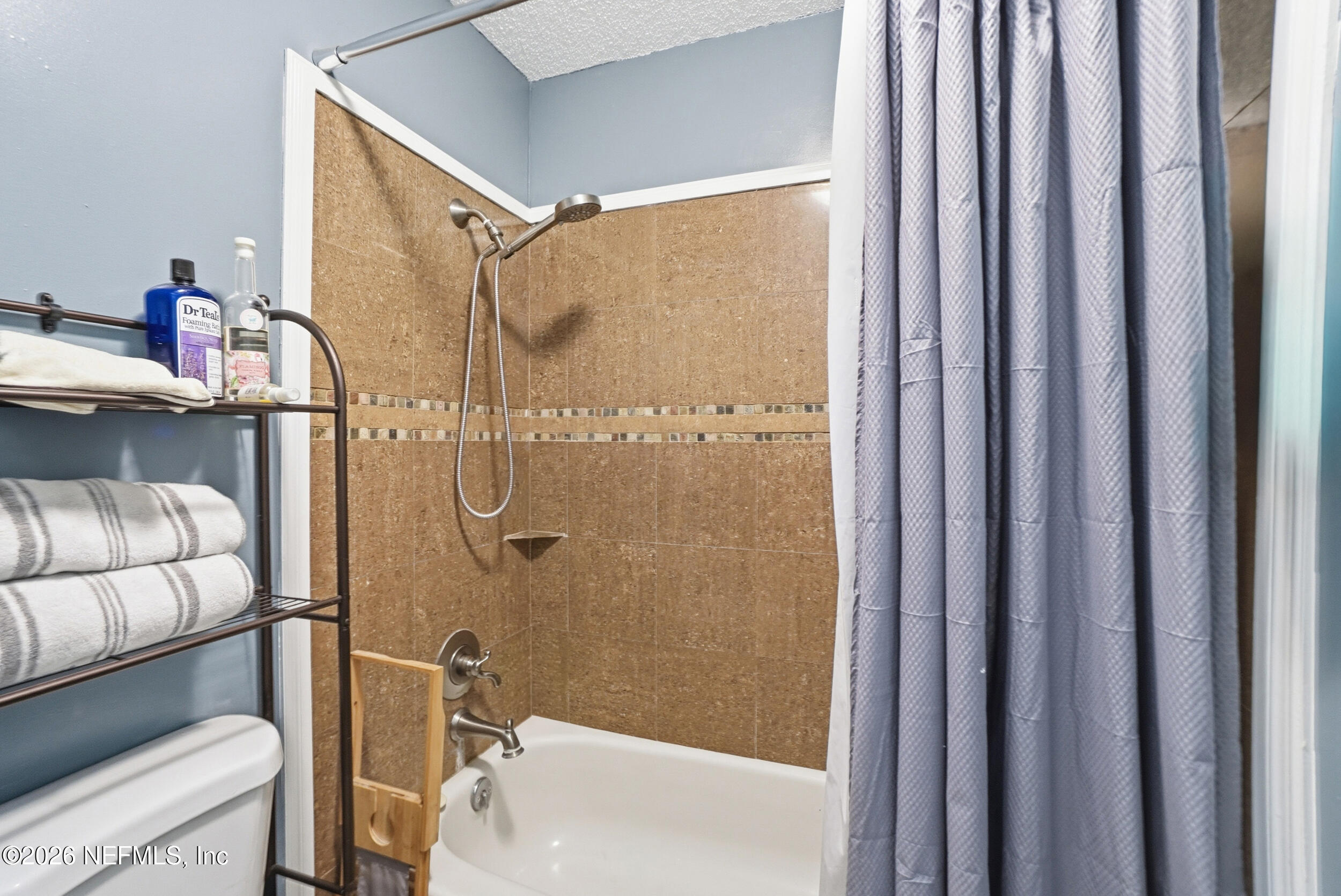 11108 Fairbanks Grant Road West Jacksonville, FL 32223 - Photo 27 of 34 a bathroom with a shower and a sink