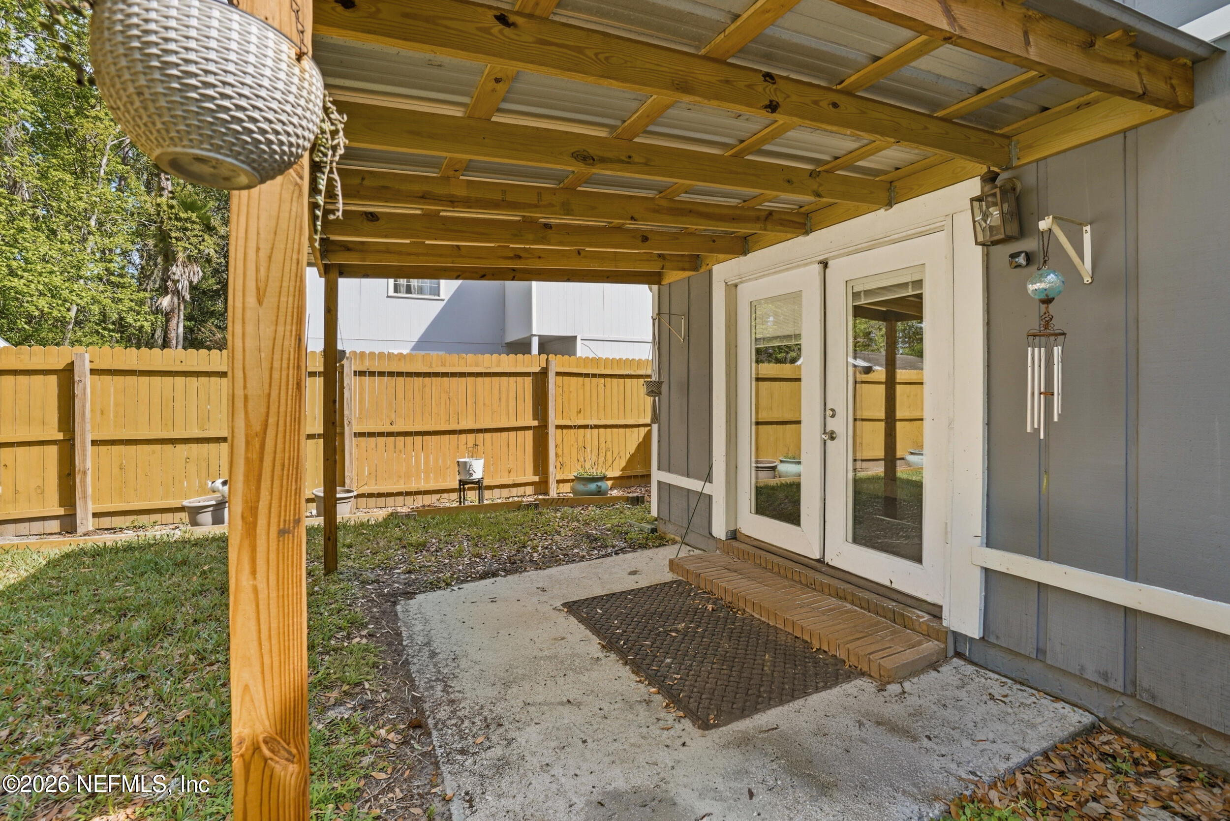 11108 Fairbanks Grant Road West Jacksonville, FL 32223 - Photo 30 of 34 a view of a porch with a door