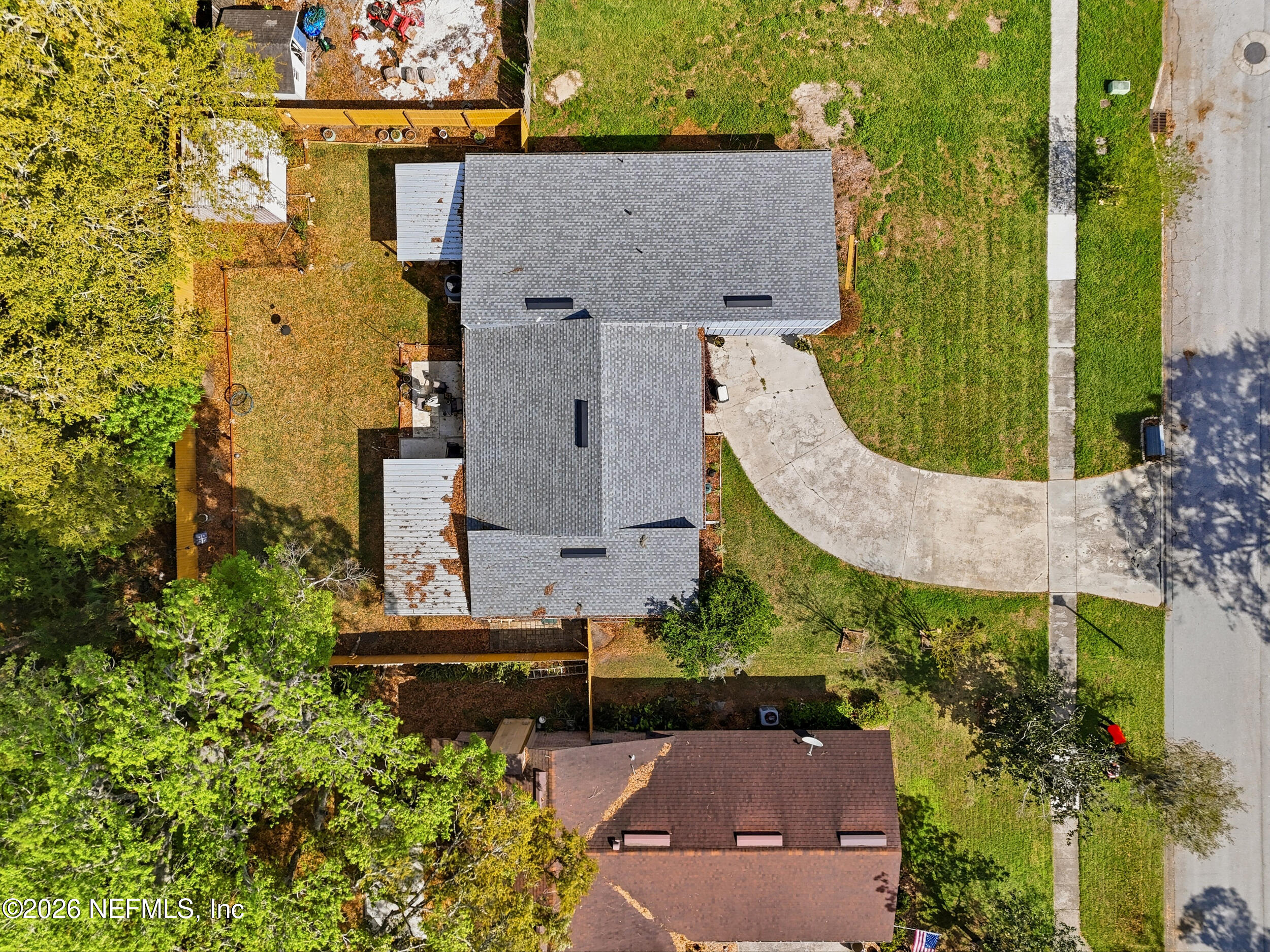 11108 Fairbanks Grant Road West Jacksonville, FL 32223 - Photo 34 of 34 an aerial view of a house with a garden and trees