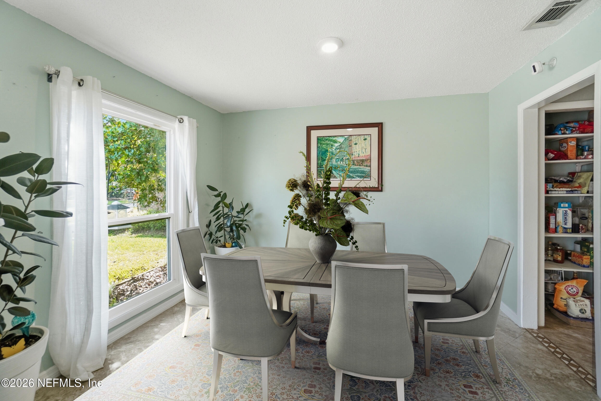 11108 Fairbanks Grant Road West Jacksonville, FL 32223 - Photo 7 of 34 a dining room with furniture and window