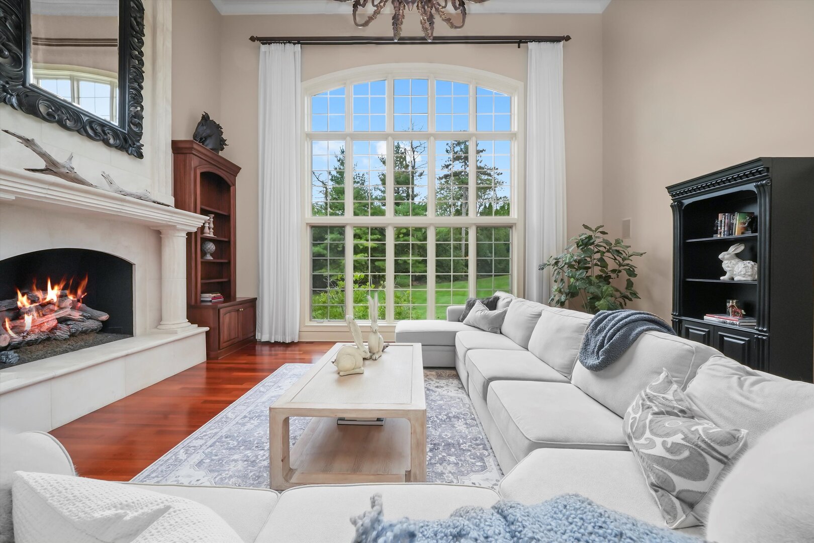80 Geneva Court Inverness, IL 60010 - Photo 16 of 62 a living room with furniture a fireplace and a large window
