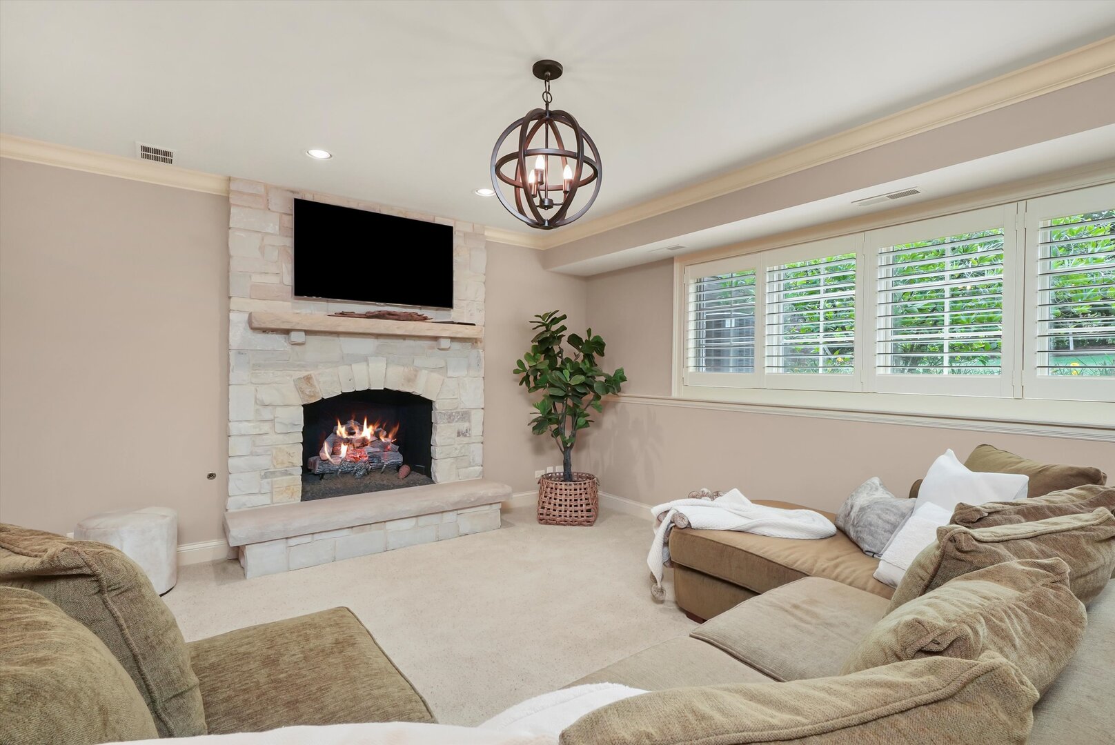 80 Geneva Court Inverness, IL 60010 - Photo 26 of 62 a living room with furniture a flat screen tv and a fireplace