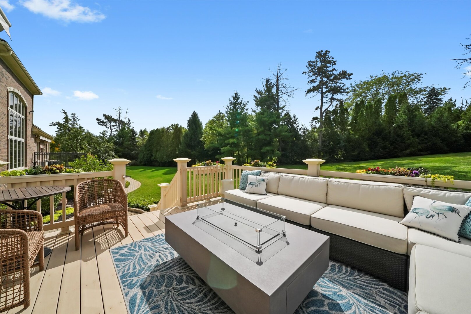 80 Geneva Court Inverness, IL 60010 - Photo 48 of 62 a view of a patio with couches table and chairs with wooden floor and fence