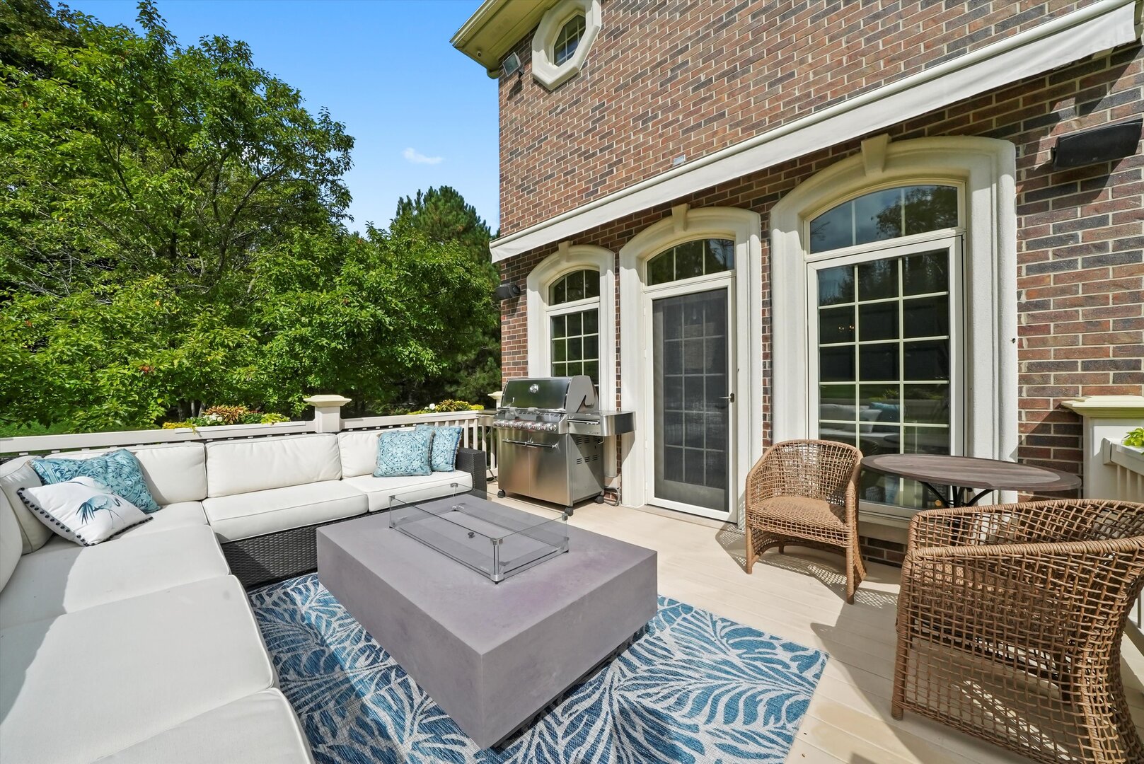 80 Geneva Court Inverness, IL 60010 - Photo 49 of 62 a view of a patio with couches table and chairs with wooden floor and fence