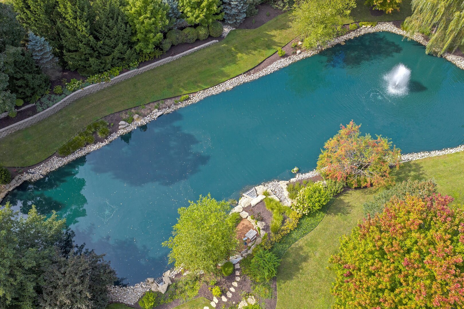 80 Geneva Court Inverness, IL 60010 - Photo 56 of 62 a view of a lake with a yard