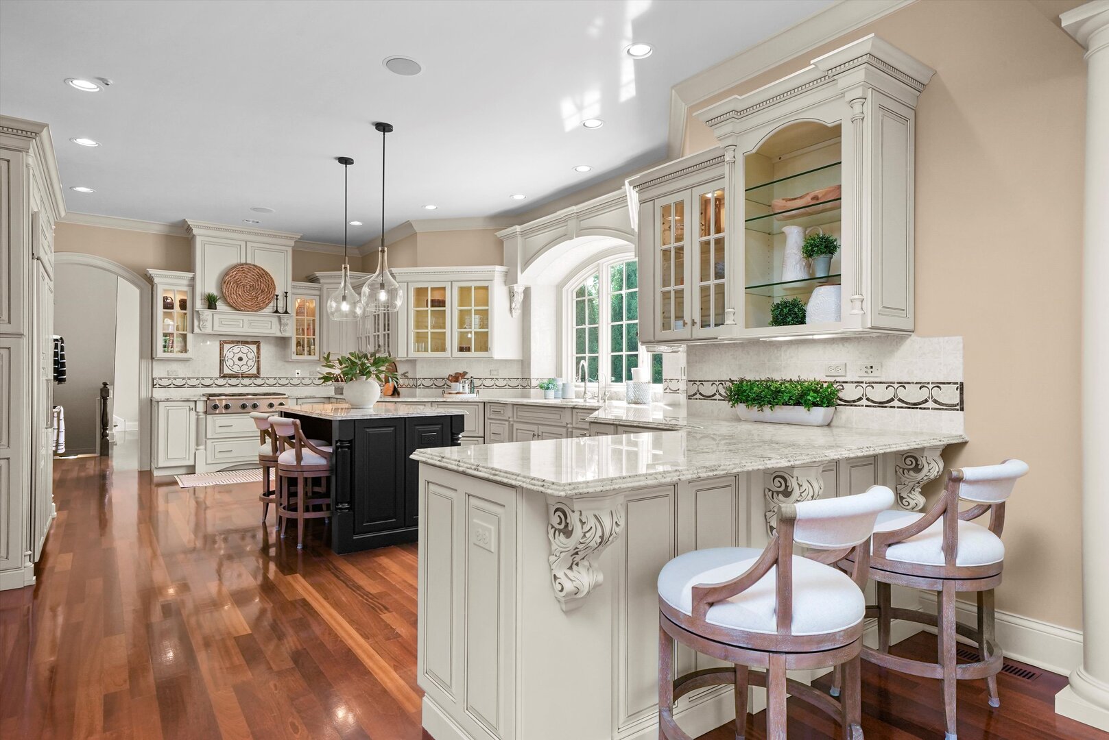 80 Geneva Court Inverness, IL 60010 - Photo 9 of 62 a kitchen with stainless steel appliances granite countertop a stove a sink dishwasher a dining table and chairs with wooden floor
