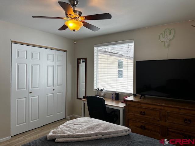 18469 Rd South Cortez, CO 81321 - Photo 12 of 34 a bedroom with a bed and a chandelier