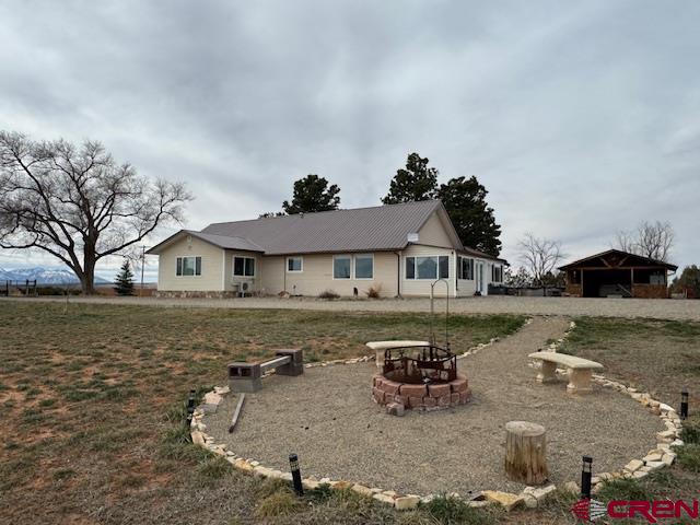 18469 Rd South Cortez, CO 81321 - Photo 14 of 34 a front view of a house with a yard