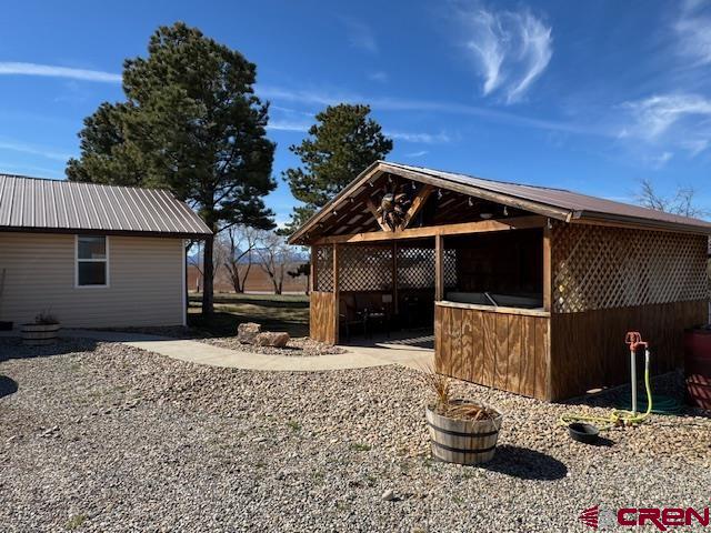 18469 Rd South Cortez, CO 81321 - Photo 15 of 34 a front view of a house with a yard